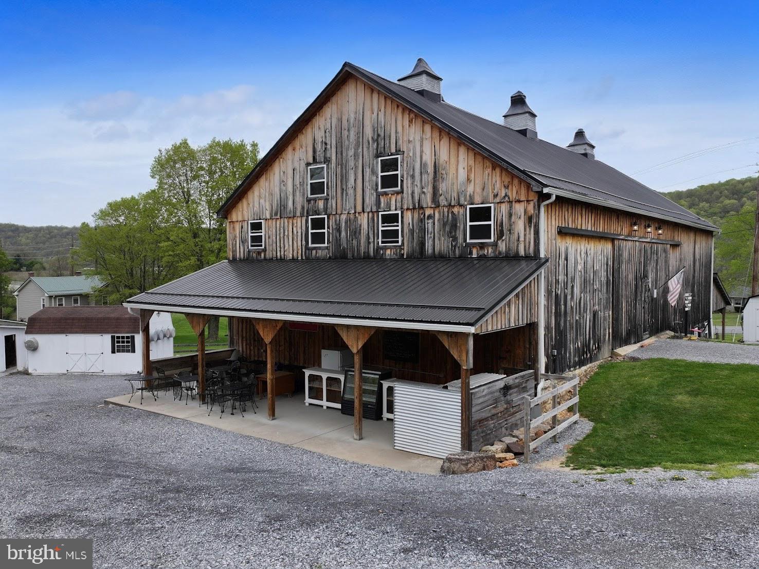 1568 Cumberland Road Bedford, PA 15522 - Photo 25 of 37 a view of a house with backyard and sitting area