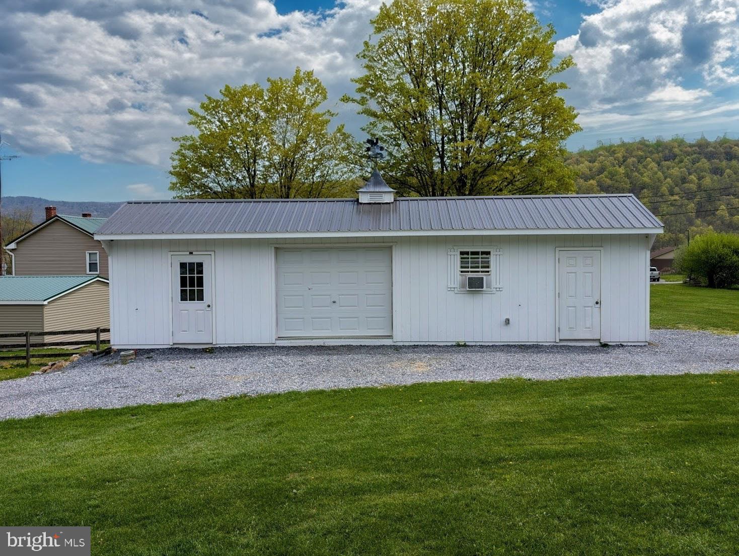 1568 Cumberland Road Bedford, PA 15522 - Photo 4 of 37 a view of a tiny house with a yard