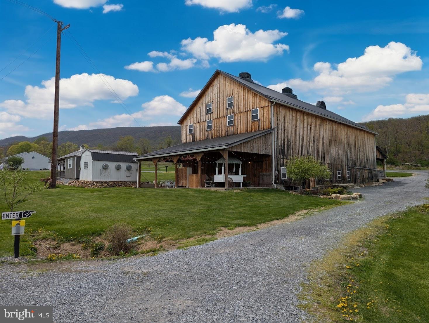 1568 Cumberland Road Bedford, PA 15522 - Photo 8 of 37 a view of a house with a yard and sitting area