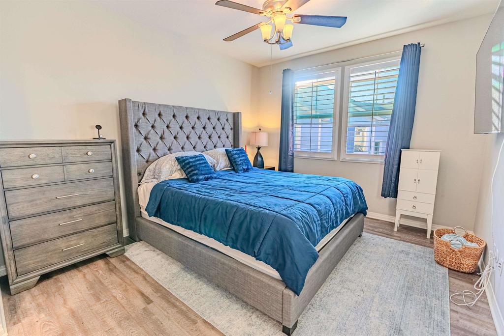 504 Hummingbird Lane Imperial Beach, CA 91932 - Photo 15 of 25 a bedroom with a bed and a chandelier