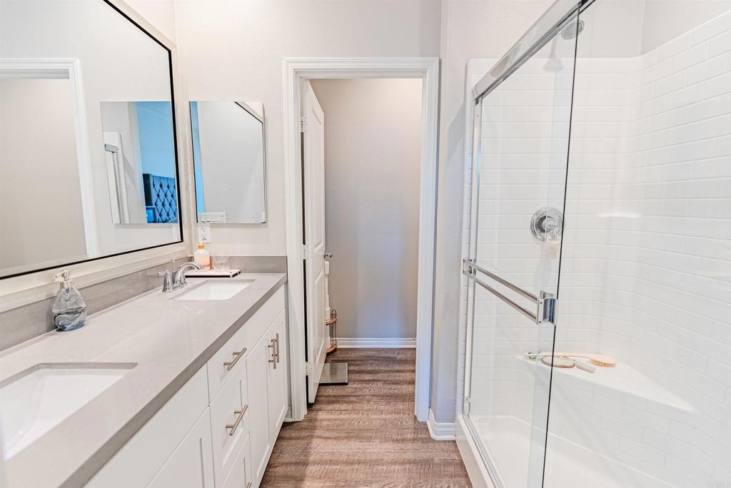 504 Hummingbird Lane Imperial Beach, CA 91932 - Photo 16 of 25 a bathroom with a double vanity sink and mirror