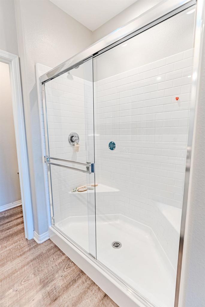 504 Hummingbird Lane Imperial Beach, CA 91932 - Photo 17 of 25 a bathroom with a glass shower door