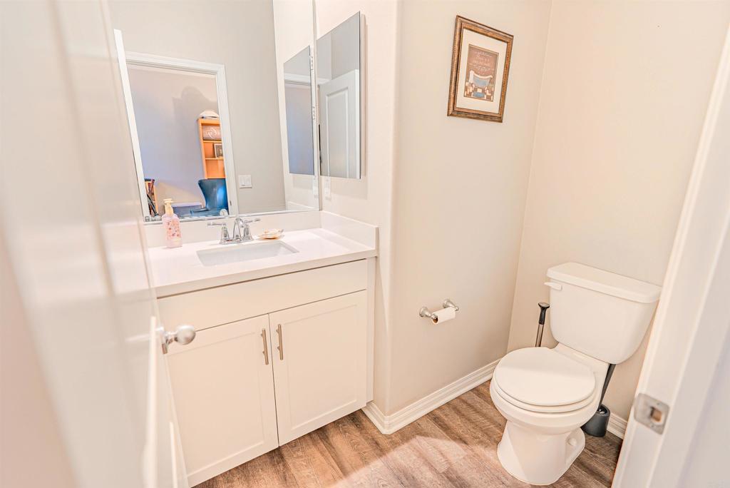 504 Hummingbird Lane Imperial Beach, CA 91932 - Photo 23 of 25 a bathroom with a sink a toilet and a mirror