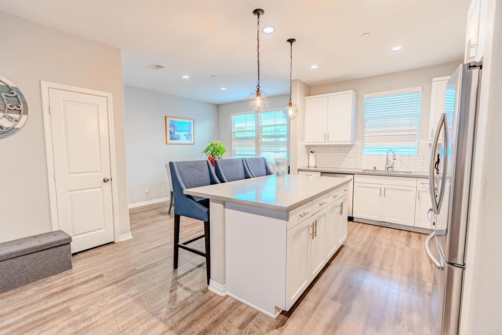 504 Hummingbird Lane Imperial Beach, CA 91932 - Photo 5 of 25 a kitchen with sink cabinets and wooden floor