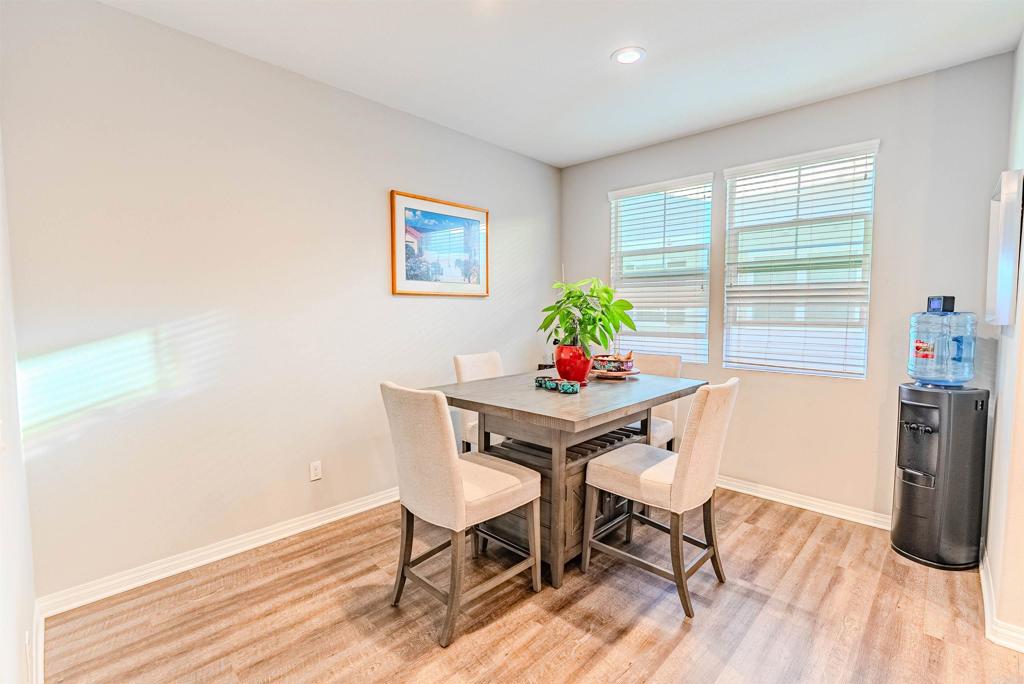 504 Hummingbird Lane Imperial Beach, CA 91932 - Photo 9 of 25 a view of a dining room with furniture and wooden floor