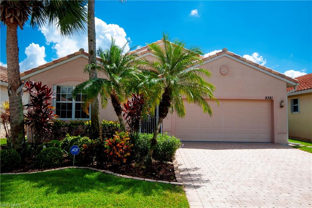 9381 Springview Loop Estero, FL 33928 - Photo 1 of 35 a view of a house with a yard and potted plants