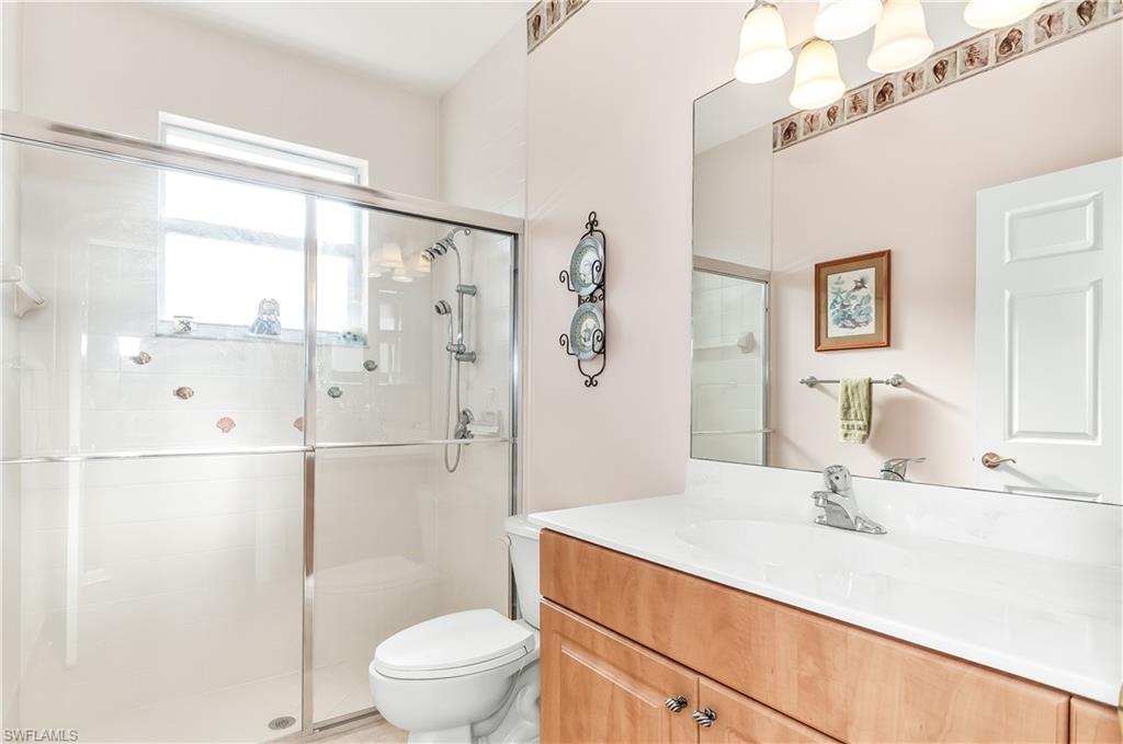 9381 Springview Loop Estero, FL 33928 - Photo 16 of 35 a bathroom with a sink toilet and shower