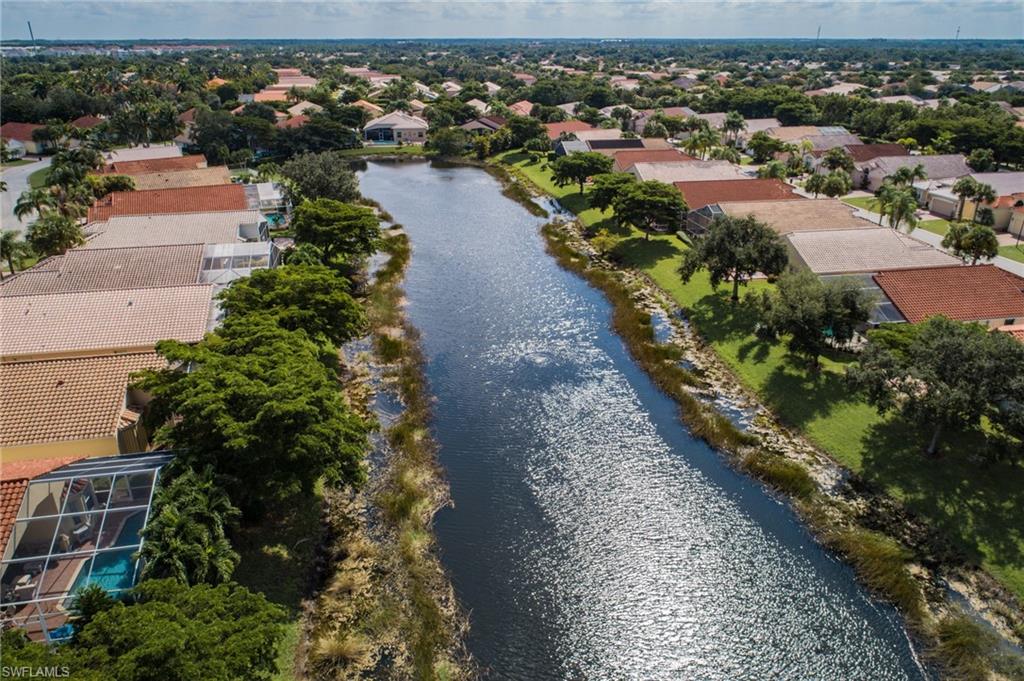 9381 Springview Loop Estero, FL 33928 - Photo 20 of 35 an aerial view of a houses with city street
