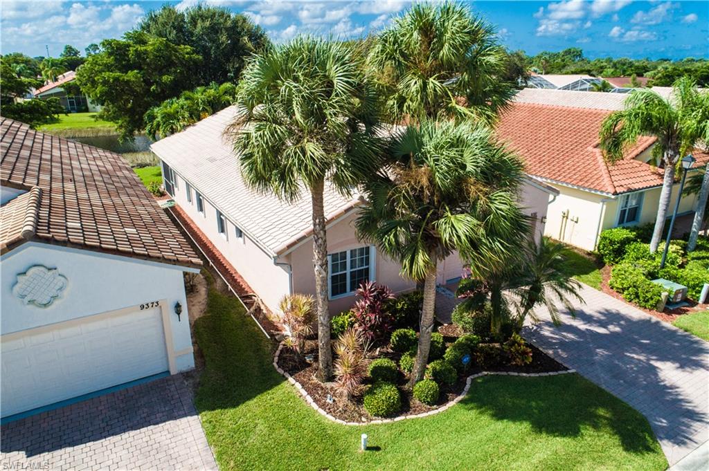 9381 Springview Loop Estero, FL 33928 - Photo 2 of 35 a front view of a house with garden