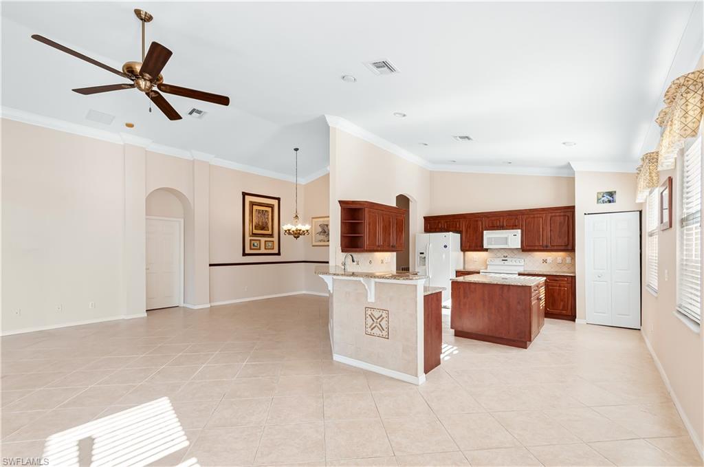 9381 Springview Loop Estero, FL 33928 - Photo 6 of 35 a view of a livingroom with a flat screen tv