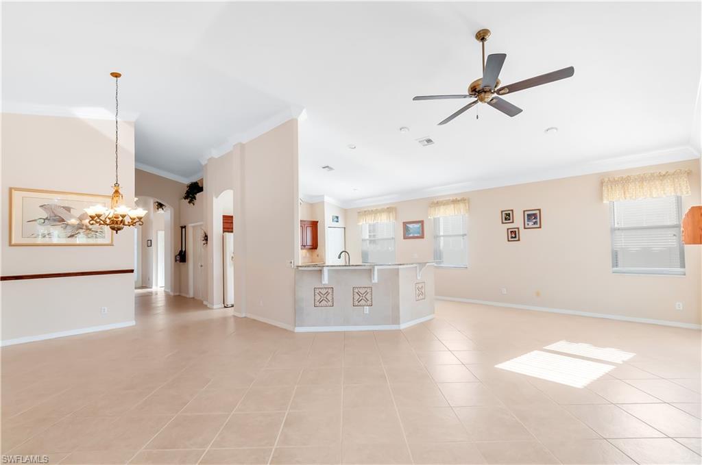9381 Springview Loop Estero, FL 33928 - Photo 7 of 35 a view of a livingroom with furniture and a ceiling fan
