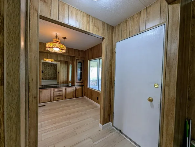 a view of a hallway with dining area