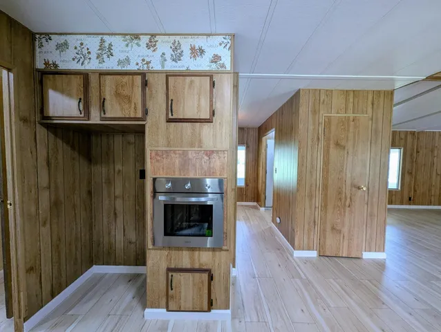 a view of hallway with wooden floor