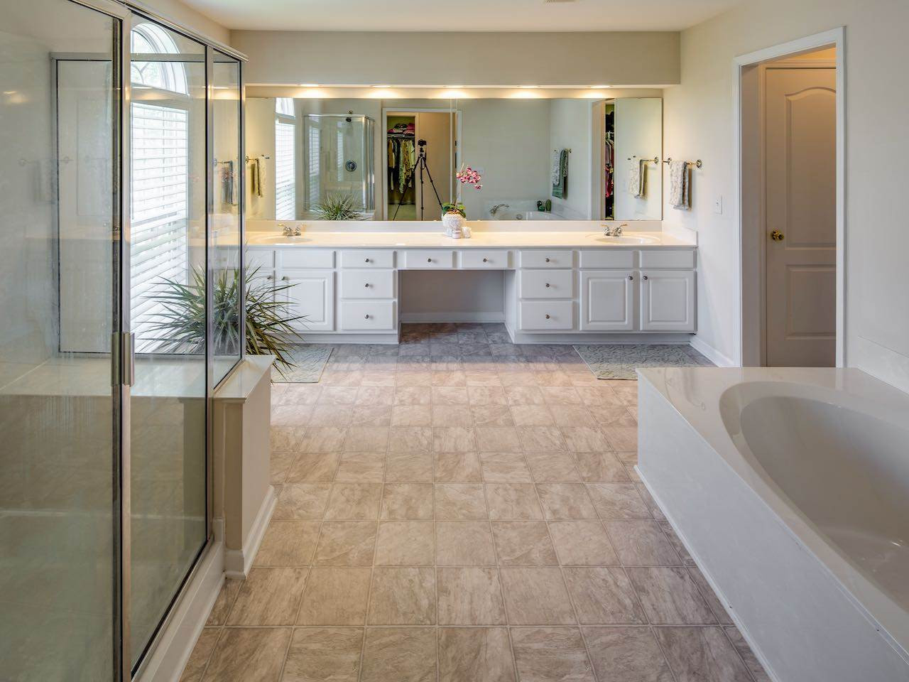7780 Silver View Lane Raleigh, NC 27613 - Photo 12 of 30 The master bathroom has a garden tub and separate shower. And there are two walk-in closets. Praise the Lord. Master bathroom
