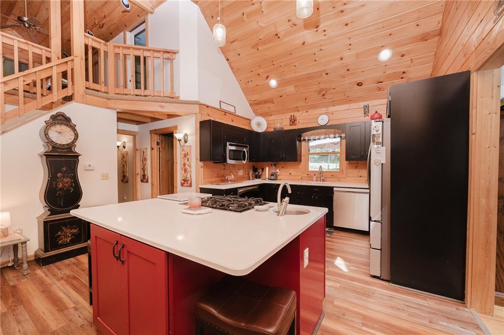 324 Troxell Spring Road Flinton, PA 16640 - Photo 17 of 50 a kitchen with stainless steel appliances granite countertop a sink a stove and a refrigerator