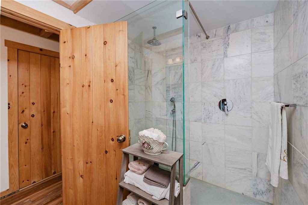 324 Troxell Spring Road Flinton, PA 16640 - Photo 20 of 50 a bathroom with a granite countertop shower a mirror and a sink