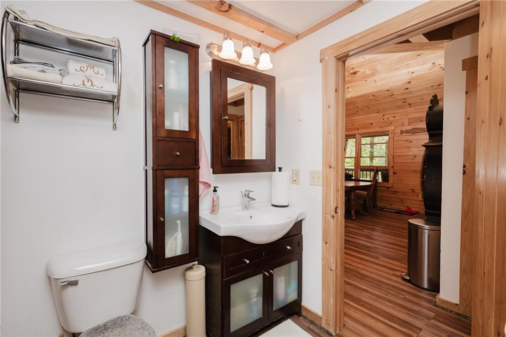 324 Troxell Spring Road Flinton, PA 16640 - Photo 21 of 50 a bathroom with a sink a toilet and a mirror