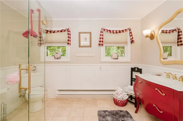 a bathroom with a tub sink and window