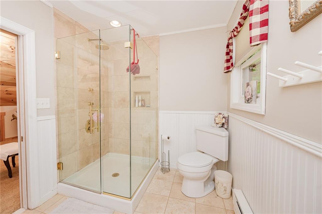 324 Troxell Spring Road Flinton, PA 16640 - Photo 28 of 50 a bathroom with a shower toilet and sink