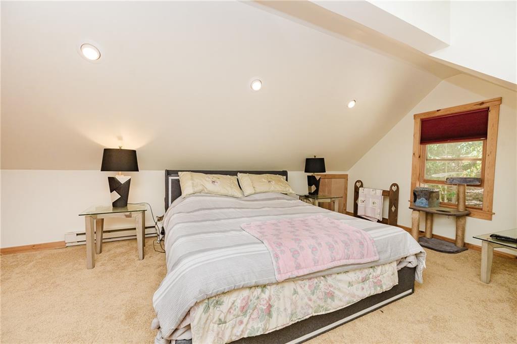 324 Troxell Spring Road Flinton, PA 16640 - Photo 33 of 50 a bedroom with a bed and lamp with table