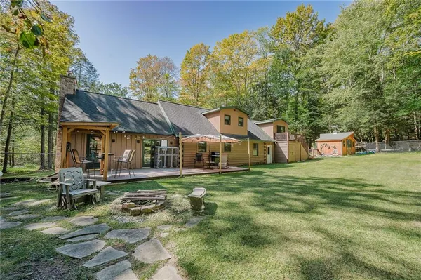 a front view of a house with a garden