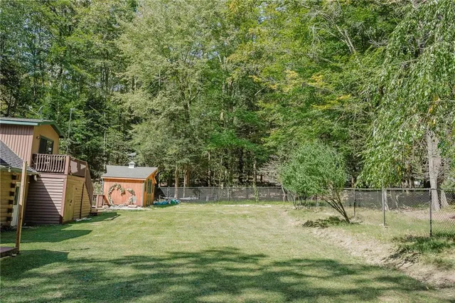 a backyard of a house with lots of green space