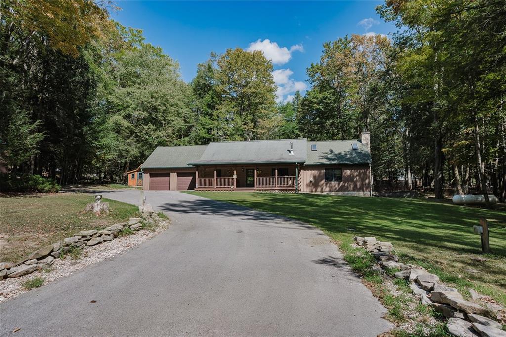 324 Troxell Spring Road Flinton, PA 16640 - Photo 4 of 50 a view of a house with a garden