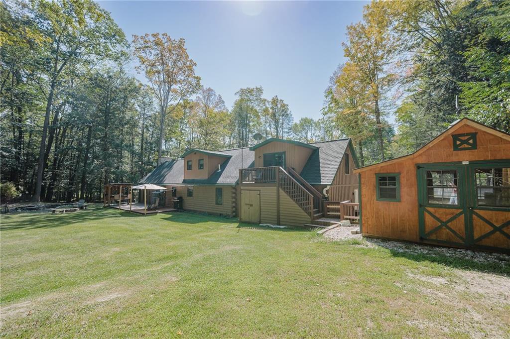 324 Troxell Spring Road Flinton, PA 16640 - Photo 48 of 50 a view of a house with backyard and a tree