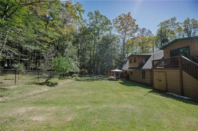 a view of a backyard with sitting area
