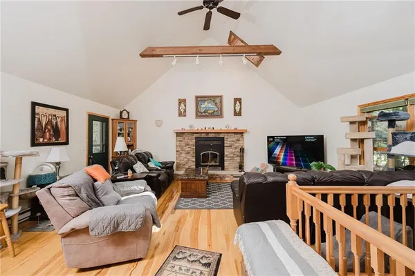 a living room with furniture fireplace and rug