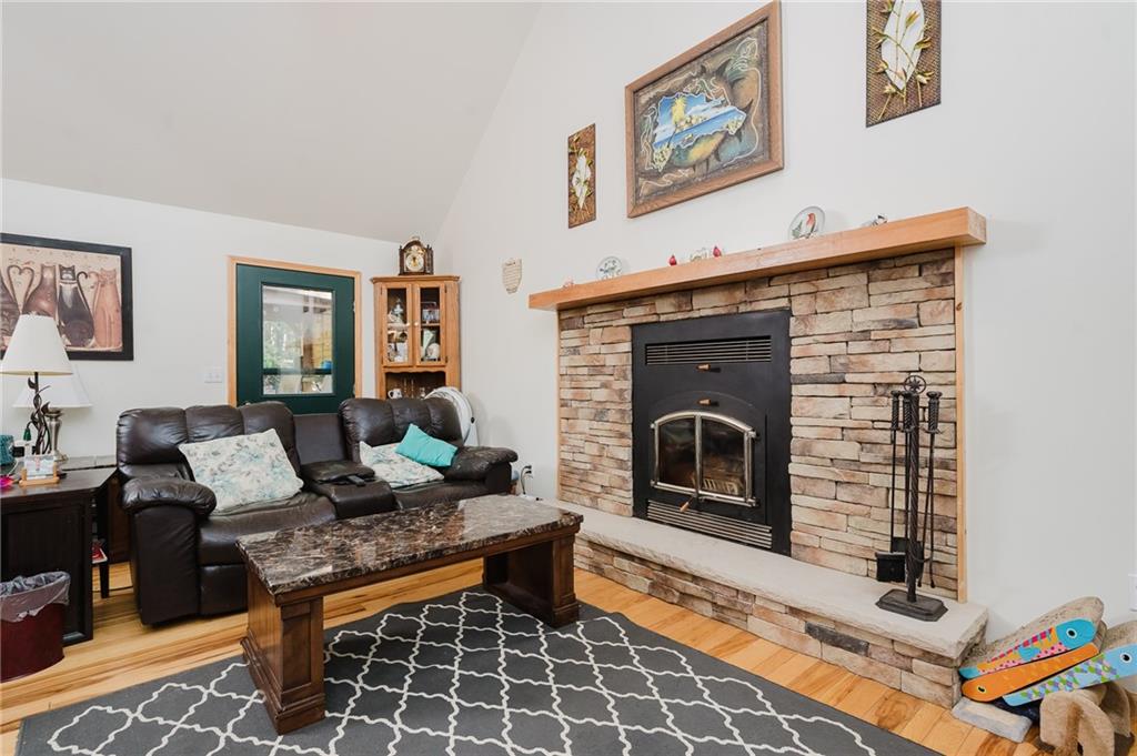 324 Troxell Spring Road Flinton, PA 16640 - Photo 7 of 50 a living room with furniture a rug and a fireplace