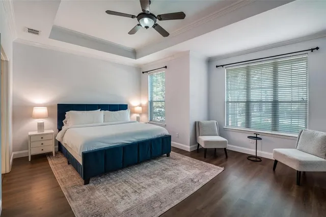 a bedroom with a bed a couch and a window