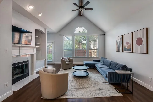 a living room with furniture and a fireplace