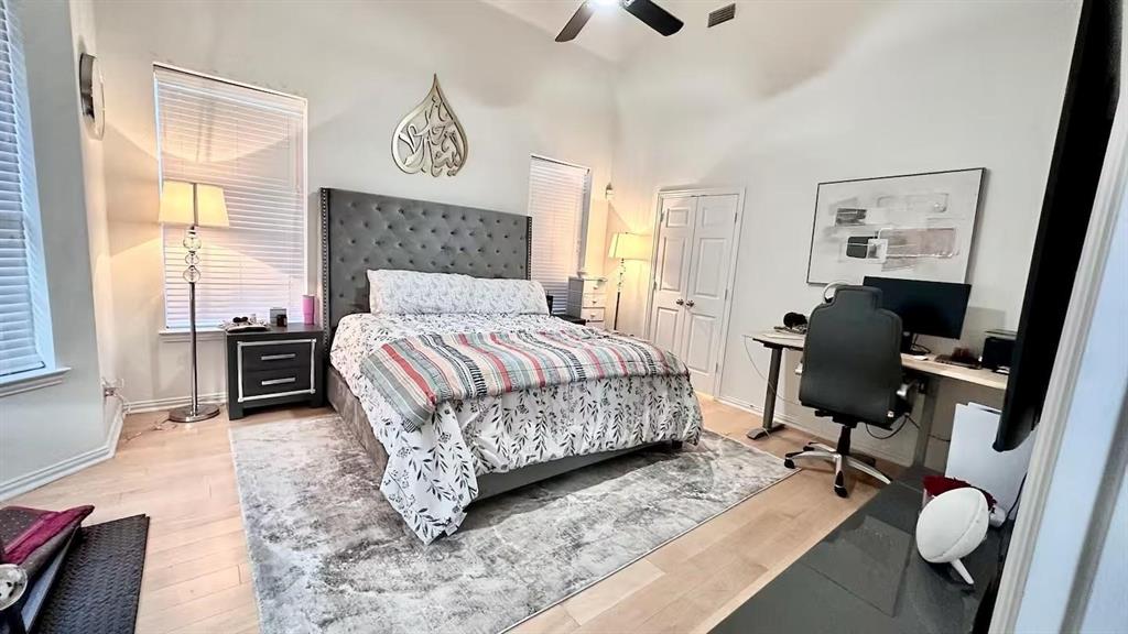 1237 Tioga Drive Irving, TX 75063 - Photo 6 of 15 a bedroom with a bed dresser and a window