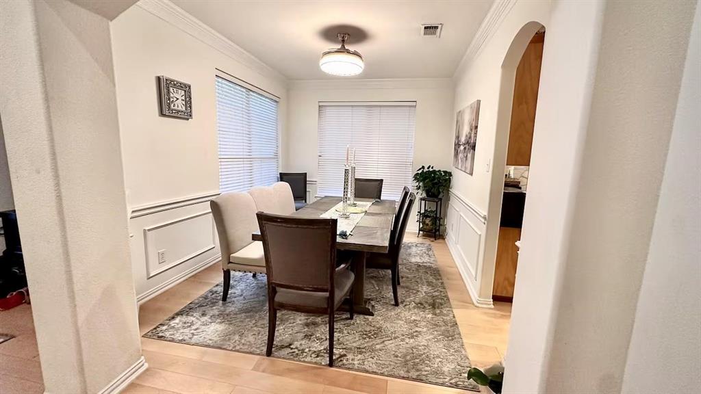 1237 Tioga Drive Irving, TX 75063 - Photo 7 of 15 a view of a dining room with furniture and a chandelier