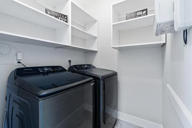 a utility room with dryer and washer