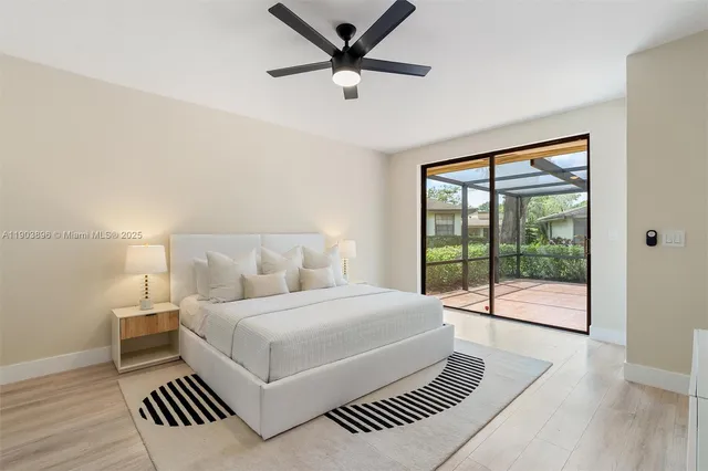 a bedroom with a large bed and a large window