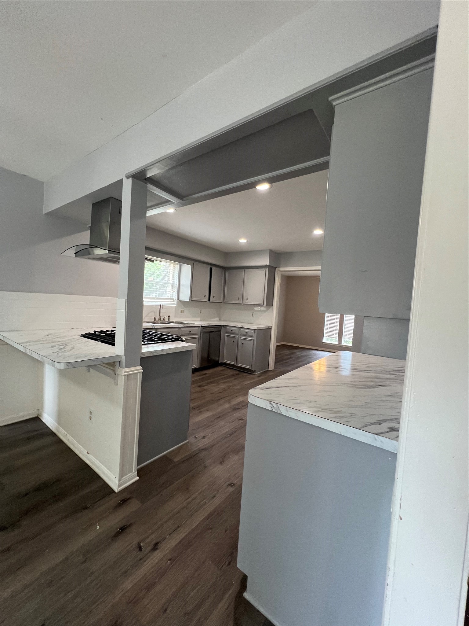 2015 Hamlin Valley Drive Houston, TX 77090 - Photo 13 of 31 a room with stainless steel appliances wooden floors and kitchen view