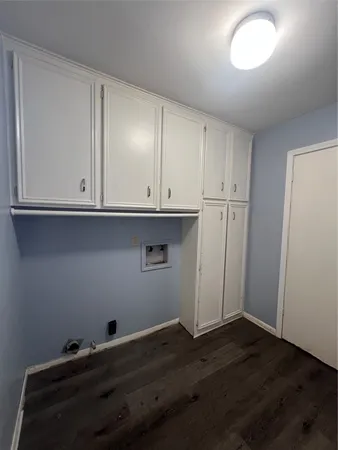 a view of cabinets and wooden floor