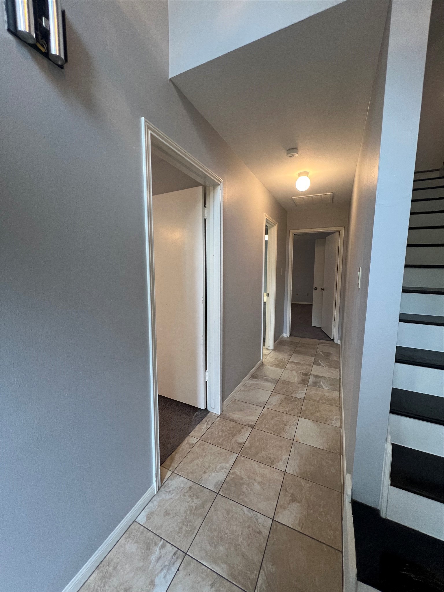 2015 Hamlin Valley Drive Houston, TX 77090 - Photo 15 of 31 a view of a hallway with wooden cabinets