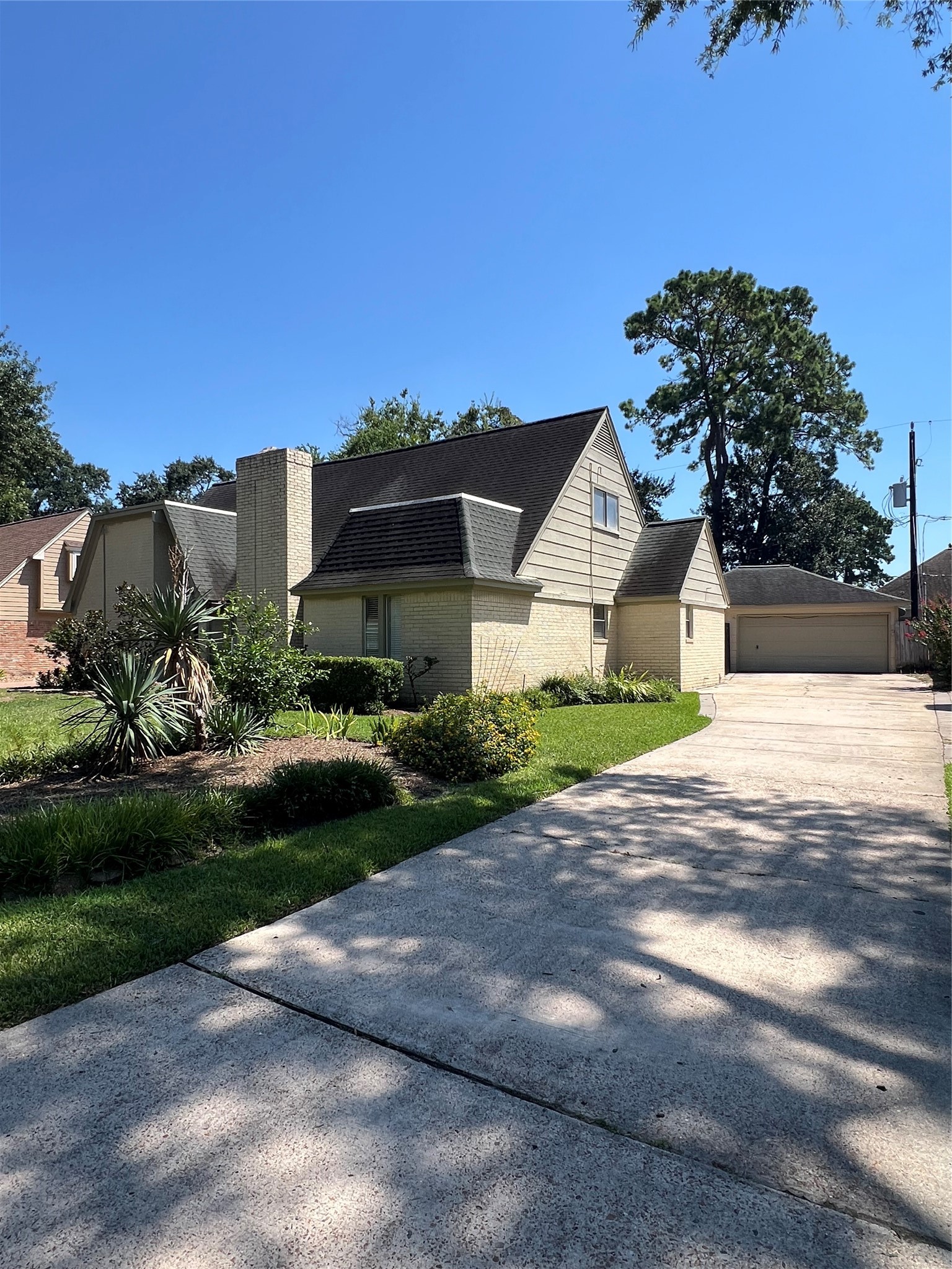 2015 Hamlin Valley Drive Houston, TX 77090 - Photo 2 of 31 a front view of a house with a yard and garage