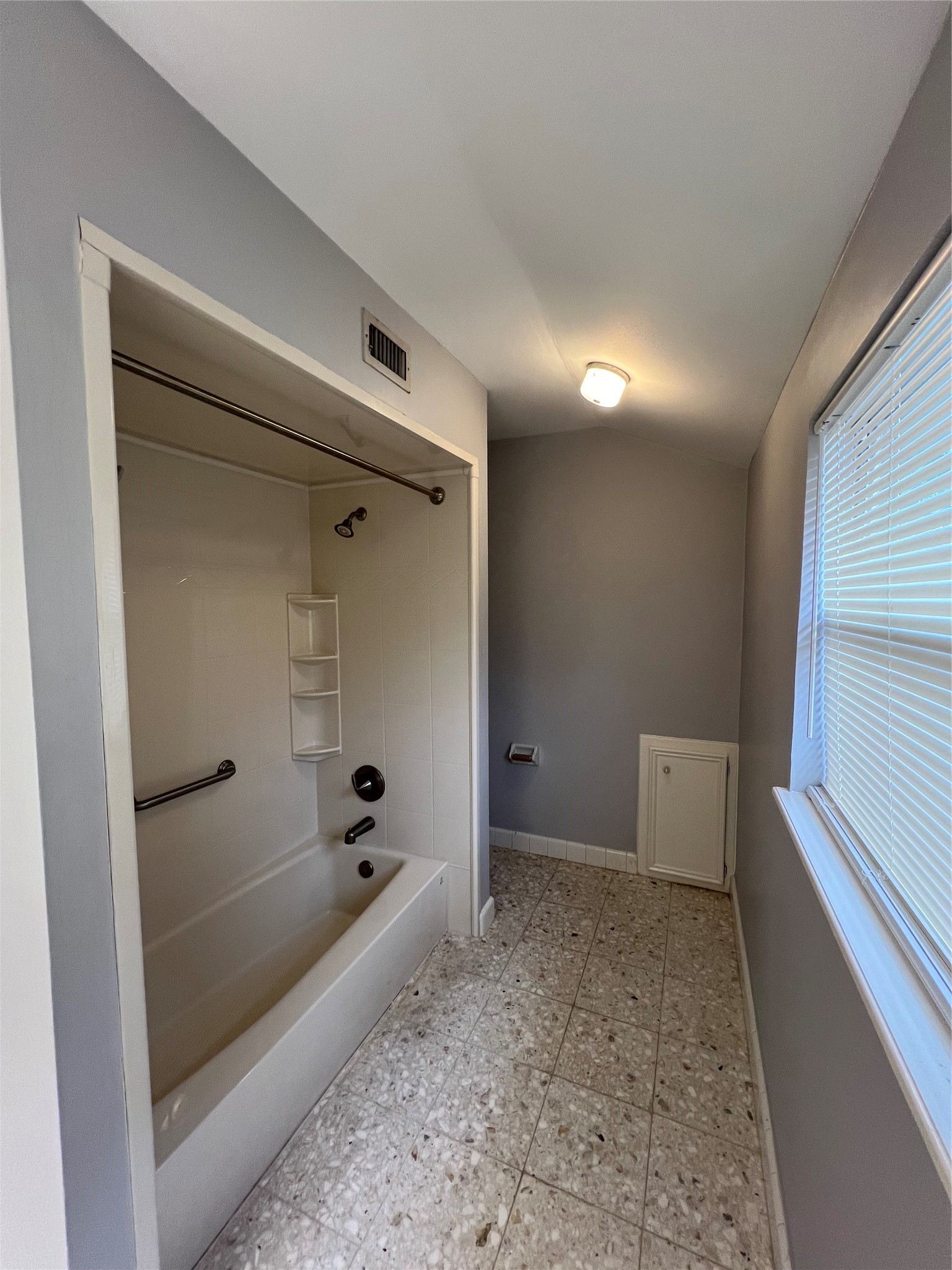 2015 Hamlin Valley Drive Houston, TX 77090 - Photo 24 of 31 a bathroom with a bathtub and shower