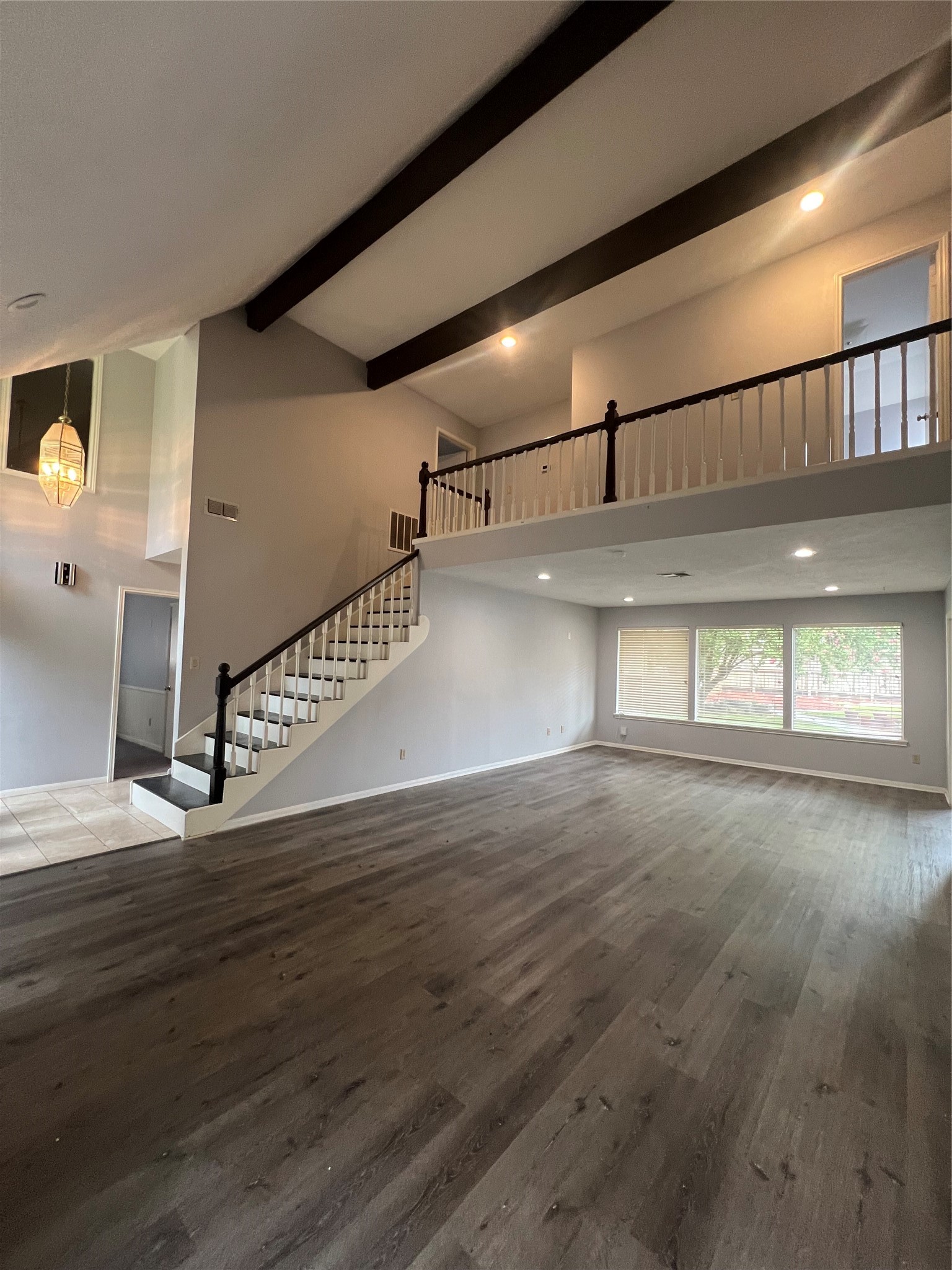 2015 Hamlin Valley Drive Houston, TX 77090 - Photo 6 of 31 a view of a hallway with wooden floor