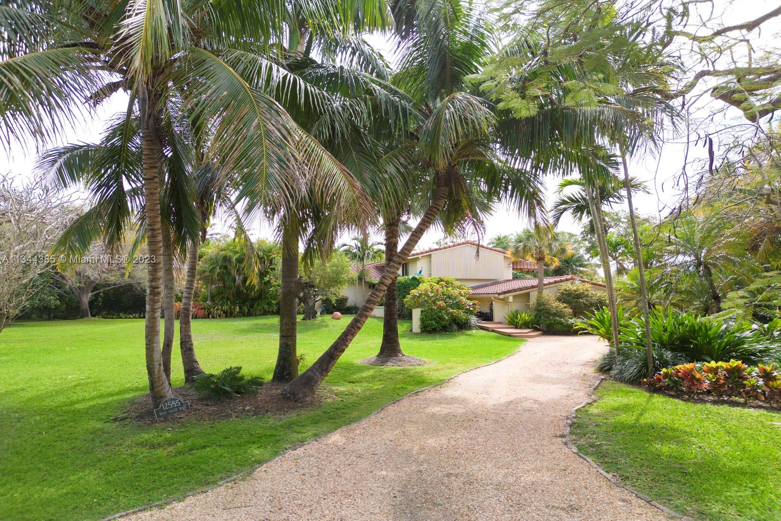 12555 Moss Ranch Road Pinecrest, FL 33156 - Photo 7 of 26 a view of a park with palm trees