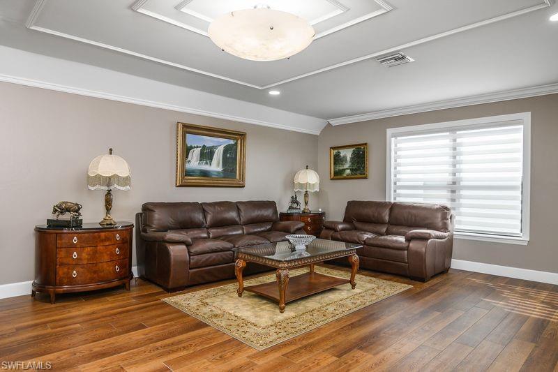 16309 Winfield Lane Naples, FL 34110 - Photo 22 of 36 a living room with furniture and a window