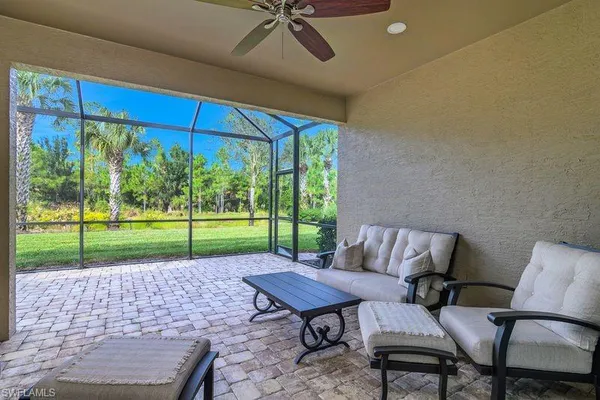 a view of a backyard with a sitting area