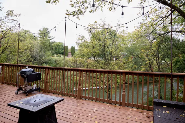 a kitchen with sink refrigerator and dining table