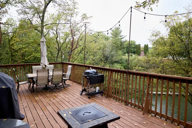 a kitchen with stainless steel appliances granite countertop a sink refrigerator and cabinets