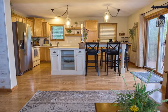 a bedroom with a bed chair and a window