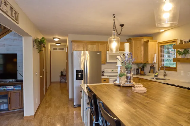 a bedroom with a large bed and a large mirror